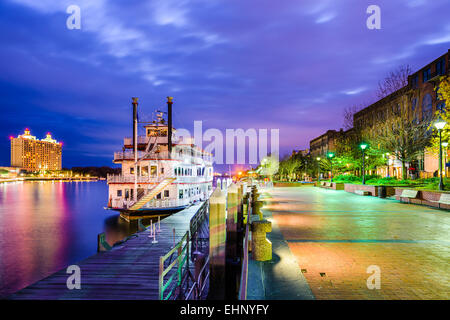 Savannah, Georgia, USA riverfront promenade at twilight. Stock Photo