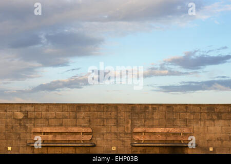 Two empty benches on the pier in New Brighton, New Zealand Stock Photo