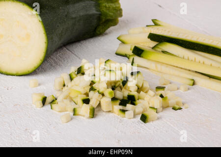 Fresh marrow or courgette cut into batons and diced into small cubes for use in salads and as a vegetable in cooking Stock Photo