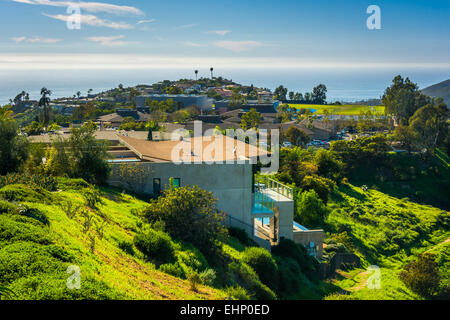 View of green hills and houses overlooking the Pacific Ocean, in Laguna Beach, California. Stock Photo