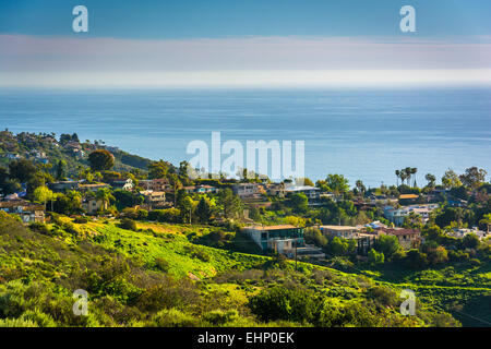 View of green hills and houses overlooking the Pacific Ocean, in Laguna Beach, California. Stock Photo