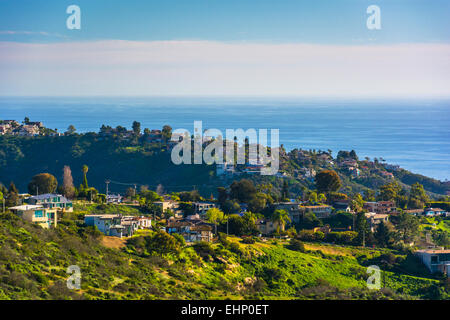 View of green hills and houses overlooking the Pacific Ocean, in Laguna Beach, California. Stock Photo