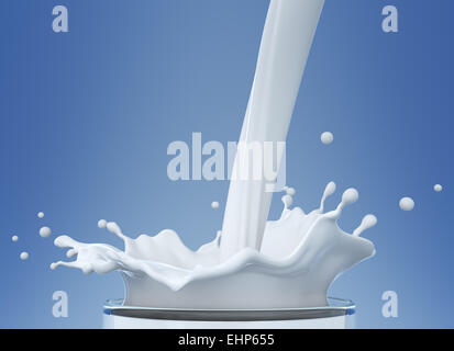 Pouring milk in glass Stock Photo