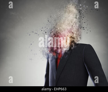 Overworked  businessman standing headless with explosion instead of his head Stock Photo