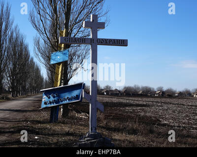 Ukraine. 16th Mar, 2015. Exit from Ilovaysk in Mnogopillja. Damaged entry sign. - Caught in August 2014 Ilovaysk turned pro-Russian militants staging post of weapons and ammunition. According to the press center of the Ministry of Defense of Ukraine March 16, 2015 from Russia arrived in the city of 16 wagons of ammunition. Credit:  Igor Golovnov/Alamy Live News Stock Photo