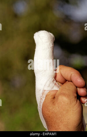 white medicine bandage on injury finger Stock Photo