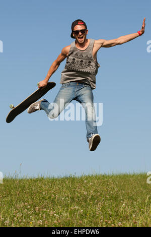 Skateboarder leaping in the air Stock Photo