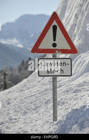 warning sign for snow and ice on road Stock Photo