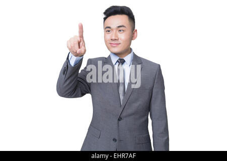 Young businessman using finger to point Stock Photo