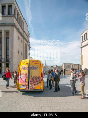 A line of people waiting at a waffles food truck in Brussels, Belgium. Stock Photo