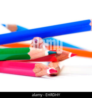 closeup of some wooden coloured pencils of different colors on a white background Stock Photo