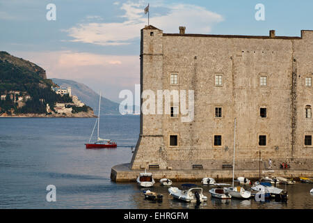 Yacht Sailing behind Fort of Saint John in Dubrovnik, Croatia Stock Photo