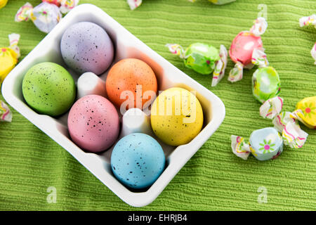 pastel colored eggs and candy Stock Photo