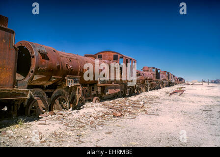 Old locomotive graveyard in desert near Salar de Uyuni in Bolivia Stock Photo