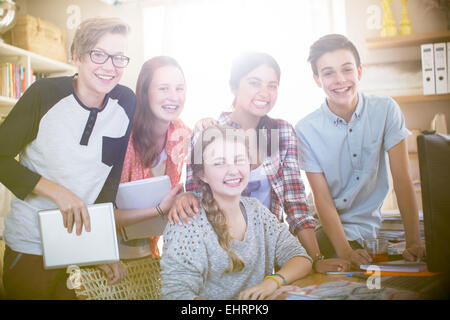 Group portrait of smiling teenagers at home Stock Photo