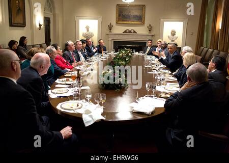 US President Barack Obama meets with Members of Congress during dinner in the Cabinet Room of the White House November 19, 2014 in Washington, DC. Stock Photo