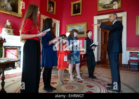 US President Barack Obama meets with student reporters in the Red Room of the White House prior to hosting the 'ConnectED to the Future' conference with superintendents and other educators from across the country who are leading their schools and districts in the transition to digital learning November 19, 2014 in Washington, DC.. Students, from left, Ainsley Felter, Scholastic News Kids Press Corp (age 13), Julie Vadhan, Huffington Post Teen (age 14), Liliana Scott, Time For Kids (age 8), Tess Harkin, Student Voice (age 17) and Sam Parekh, Kids Scoop Media (age 13). Stock Photo