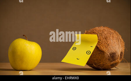 Apple with sticky post-it note looking sadly at tomato Stock Photo - Alamy