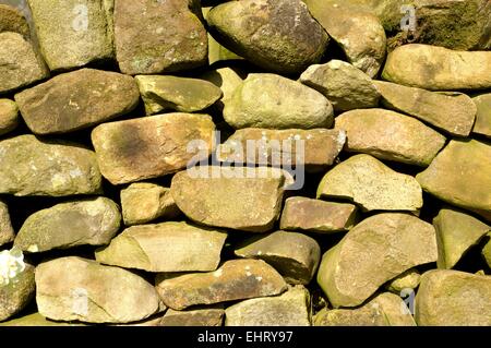 Traditional stone walling close up in the United Kingdom showing texture and irregular shapes Stock Photo