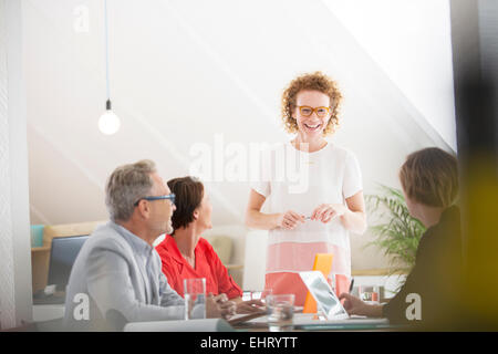 Four people at meeting in office Stock Photo