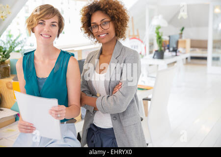 Portrait of two smiling office workers Stock Photo