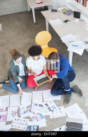 Three young people working together in studio Stock Photo