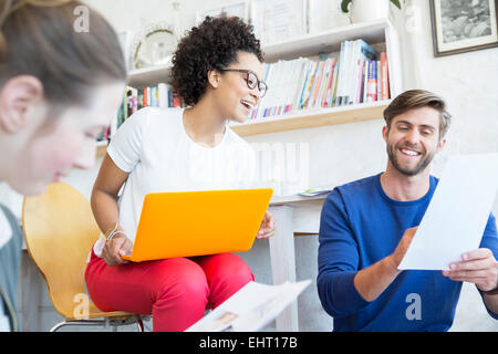 Three young people working together in studio Stock Photo