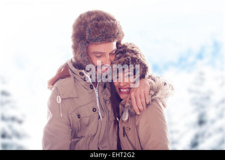 Loving couple outdoors in the snow Stock Photo