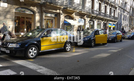 Yellow and black Barcelona taxis on Las Ramblas, Barcelona Stock Photo