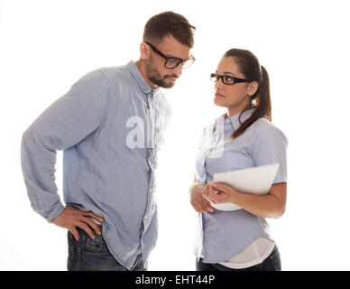 Serious couple in glass having a discussion Stock Photo
