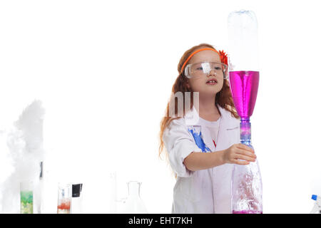 Adorable girl watching reaction of reagents Stock Photo