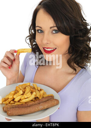Young Happy Confident Woman Eating Fresh Shop Bought Takeaway Jumbo Pork Sausages And Chips Meal Isolated Against A White Background Clipping Path Stock Photo