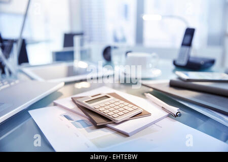 Desk in modern office filled with supplies,laptop and phone,tablet Stock Photo