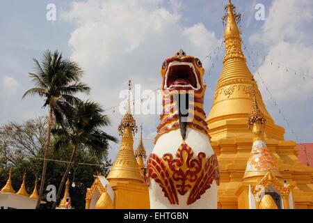 Burmese temple with lion in Sangkhlaburi, Thailand Stock Photo