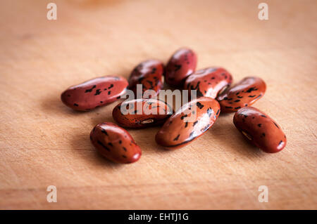 'Wisley Magic' runner beans dried ready for sowing, on wooden board Stock Photo