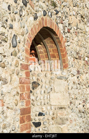Modern brick and metal reinforcement in the arch of a mediveal wall Stock Photo