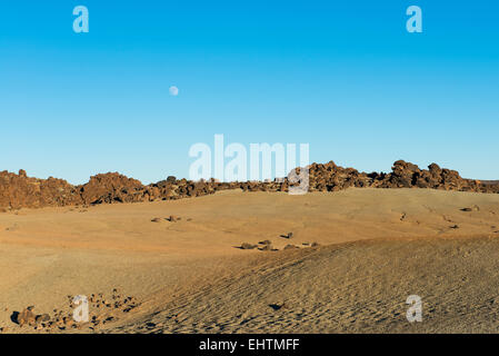 Volcano landscape with moon in National Park El Teide on Tenerife in Spain. Stock Photo
