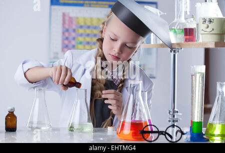 Adorable little girl conducting an experiment Stock Photo
