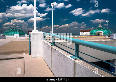 Looking up a parking garage ramp, under a blue summer sky in Towson, Maryland. Stock Photo