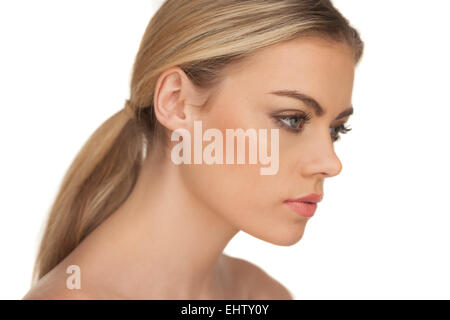 Profile portrait of a serious blond woman Stock Photo