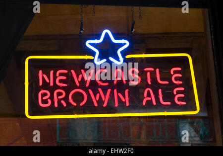 A neon sign advertising Newcastle Brown Ale in a pub window Stock Photo