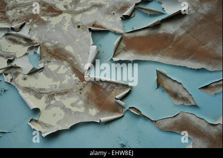 Peeling paint on weathered exterior wall of ruined building Stock Photo