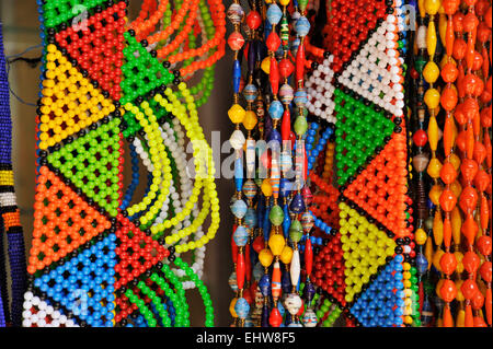 Traditional beaded Zulu costume jewellery and colourful necklaces for sale to tourists at Victoria Street Indian market, Durban, KZN, South Africa Stock Photo