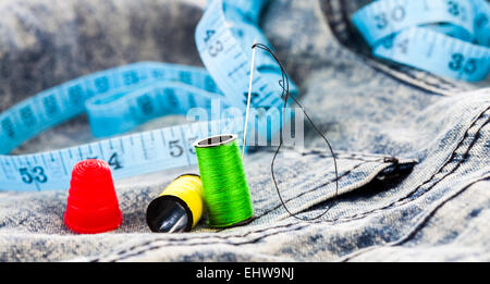 Measuring meter and sewing accessories on a white background. Yardstick.  Centimeter or Inch. Needles and threads. Tailors scissors. Seamstress tool.  C Stock Photo - Alamy