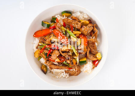Homemade pork and stir fried vegetables on a bowl of rice Stock Photo