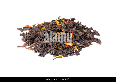 Small pile of big leaf black tea mixed with safflower and hibiscus petals isolated on white background, selective focus Stock Photo