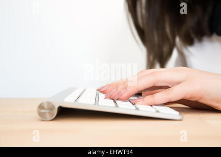 Closeup image of a female hands using keyboard Stock Photo