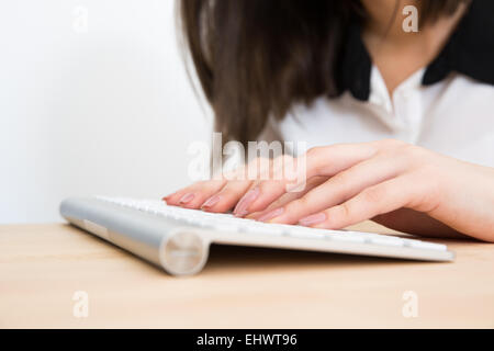 Closeup image of a female hands using keyboard Stock Photo
