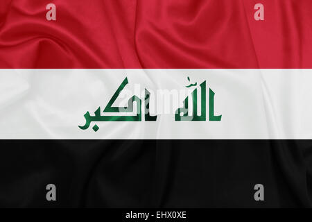 Iraq - Waving national flag on silk texture Stock Photo