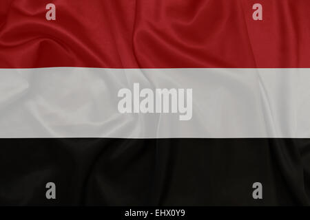 Yemen - Waving national flag on silk texture Stock Photo